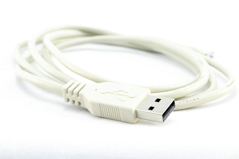 Coiled white USB cable